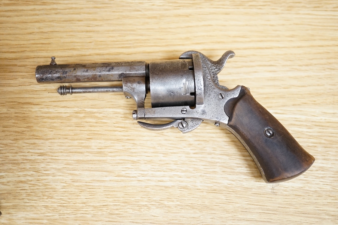 A six shot 7mm Belgian pinfire revolver and another similar, both with folding triggers and wooden grips